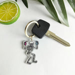 Load image into Gallery viewer, Party Skeleton Keychain - Spooky, Party &#39;Till You Die Halloween Acrylic Keychain
